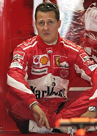 Ferrari's World Champion Michael Schumacher of Germany sits in his pit during a practice session at the Hockenheim race track, July 23, 2005.