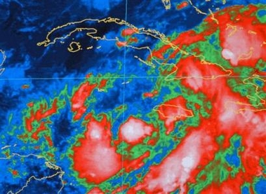 In this infrared satellite image provided by the National Oceanic and Atmospheric Administration, the center of Tropical Depression 24 is positioned about 150 miles to the southeast of Grand Cayman at 4 p.m., Sunday, Oct. 16, 2005.