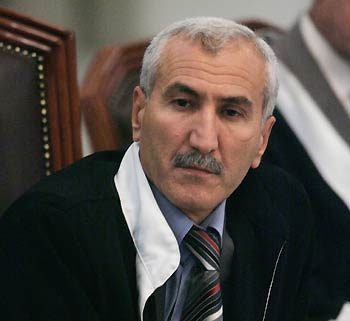 Rizgar Mohammed Amin, 47, the presiding judge of a five-judge tribunal overseeing the Saddam case, conducts the trial held under tight security in Baghdad's heavily fortified Green Zone in Iraq October 19, 2005. Saddam Hussein defiantly challenged the legitimacy of the U.S.-backed court, but then entered a plea of not guilty as he went on trial on Wednesday for crimes against humanity committed two decades ago.