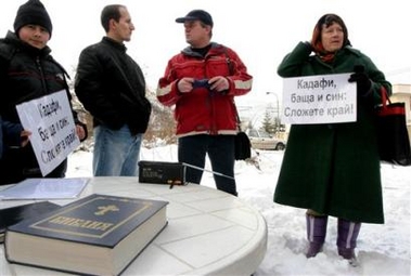 Relatives of Bulgarian nurses jailed in Libya hold banners that call on Libyan leader Moammar Gadhafi to release them, in front of the Libyan Embassy in Sofia, Sunday, Dec. 25, 2005.