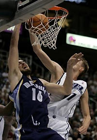 Memphis Grizzlies forward Pau Gasol (16), of Spain, scores against Utah Jazz forward Andrei Kirilenko (47), of Russia, during the first quarter of their NBA basketball game Monday, Dec. 26, 2005, in Salt Lake City.