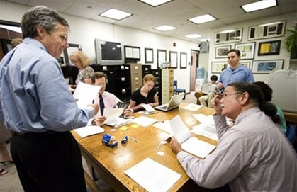 National Security Archive Executive Director Thomas Blanton, left, and Senior Fellow and CIA expert of the National Security Archive John Prados, right, confer as they examine documents, released by the Central Intelligence Agency, Tuesday, June 26, 2007, in Washington. The CIA released hundreds of pages of internal reports Tuesday on agency misconduct that triggered a scandal in the mid-1970s over government spying on Americans. (AP Photo/Manuel Balce Ceneta)